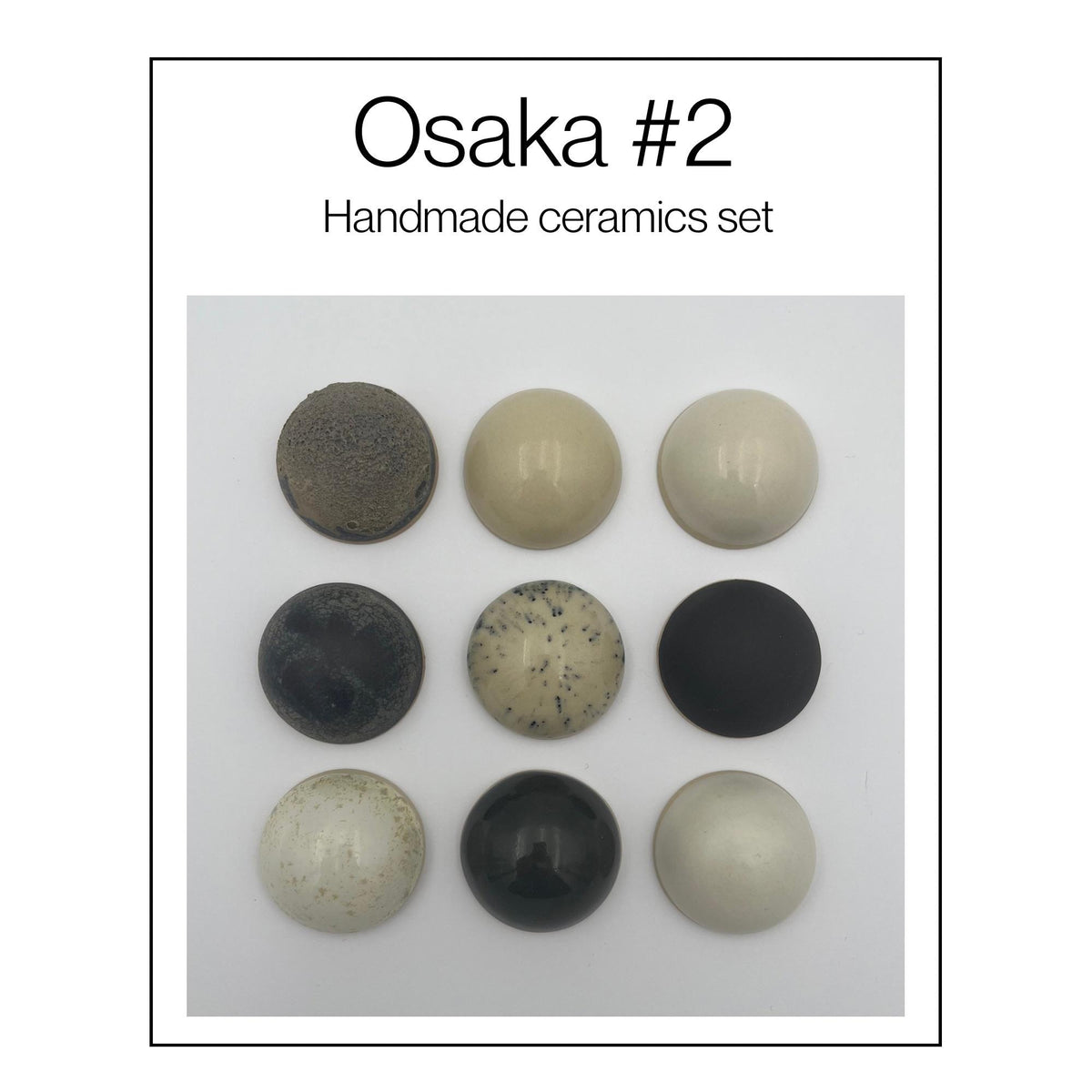 Osaka set van 9 keramische wandkoepels in zwart en gebroken wit, diameter per koepel ca. 9.5 cm